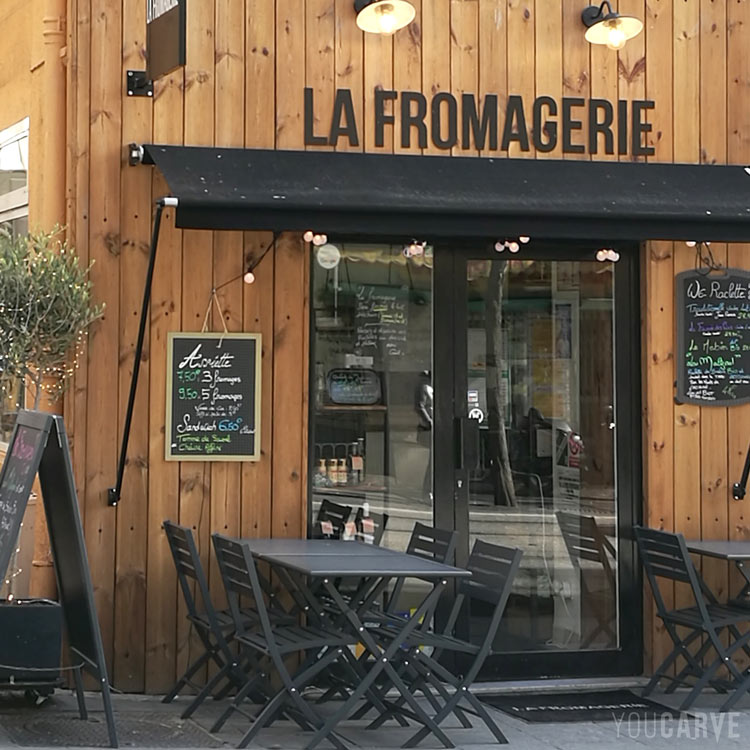 Cheese shop sign in Nice, black lacquered aluminium dibond letters placed on wooden facade