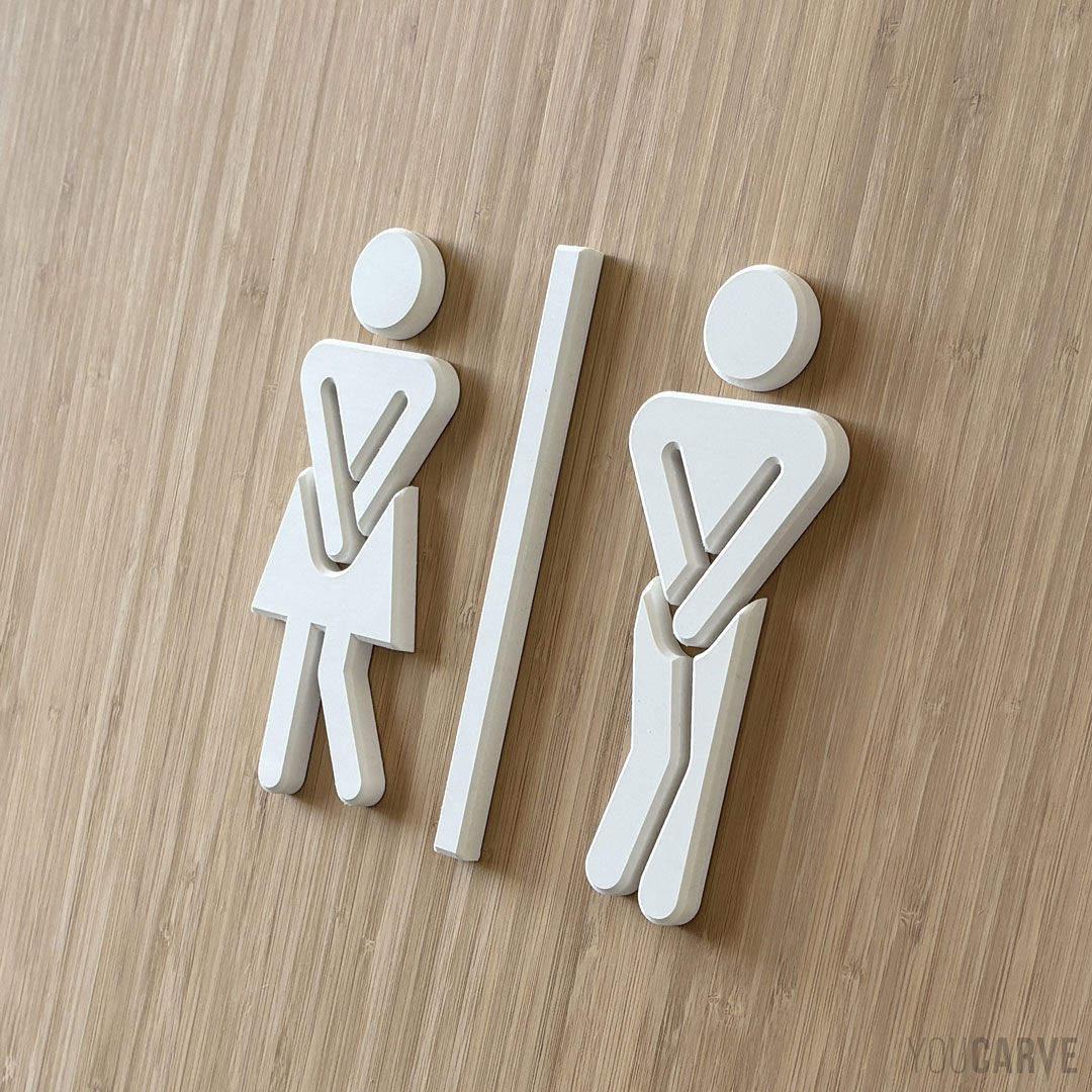 Urgent need restroom pictogram (white PVC) Humorous style urgent need restroom pictograms - Cutout of white expanded PVC 10 mm on a wood background (bamboo)